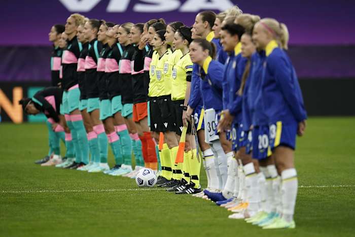 Players from Barcelona and Chelsea pictured lining up before the 2020/21 UEFA Women's Champions League final in Gothenburg, Sweden
